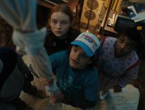 STRANGER THINGS 4. Caleb McLaughlin as Lucas Sinclair, Sadie Sink as Max Mayfield, Gaten Matarazzo as Dustin Henderson, and Priah Ferguson as Erica Sinclair
